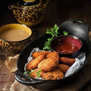 imagem do produto Porção com 10 Nuggets com molho barbecue 