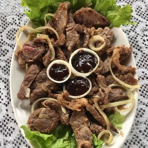 imagem do produto Porção de Contra Filé Acebolado com Barbecue 