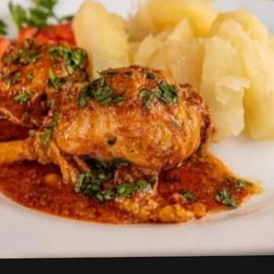 imagem do produto Macaxeira na manteiga da terra com galinha guisada 