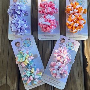 imagem do produto Duplinha de pompons em fita tons candy