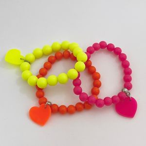 imagem do produto Trio pulseiras corações neon 