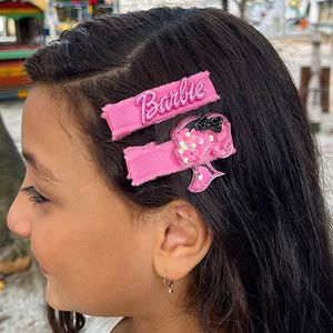 imagem do produto Dois hair clip um com a logo e um com a silhueta 