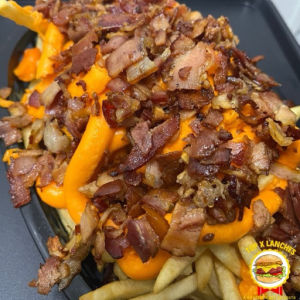 imagem do produto Porção de batata com cheddar cremoso e bacon + coca cola lata 350