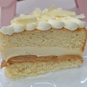 imagem do produto Fatia de bolo de ninho com doce de leite