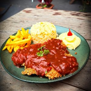 imagem do produto Frango a parmegiana com arroz de brócolis ou arroz a grega (opcional)
