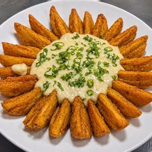 imagem do produto Batata rústica ao molho de queijo 