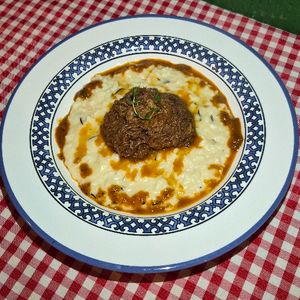 imagem do produto Risoto de Parmesão com Ragu de Carne ao Vinho 