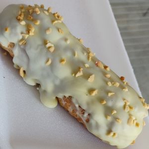 imagem do produto Bomba de doce de leite cobertura de pistache 