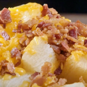 imagem do produto Porção de aimpim com queijo e bacon.