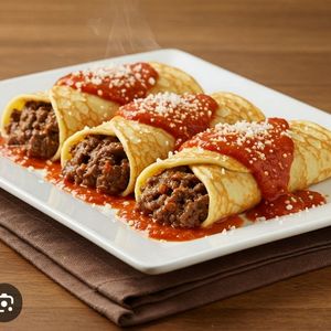 imagem do produto Panqueca de carne moída com molho vermelho e queijo