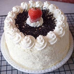 imagem do produto Bolo recheado de ninho com brigadeiro 1,500 kg